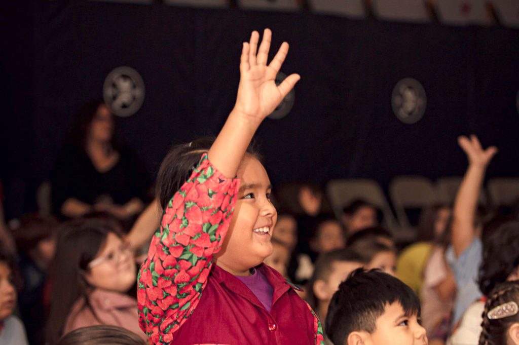 student raising hand