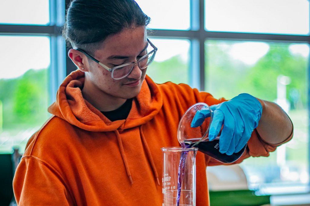 student in science class