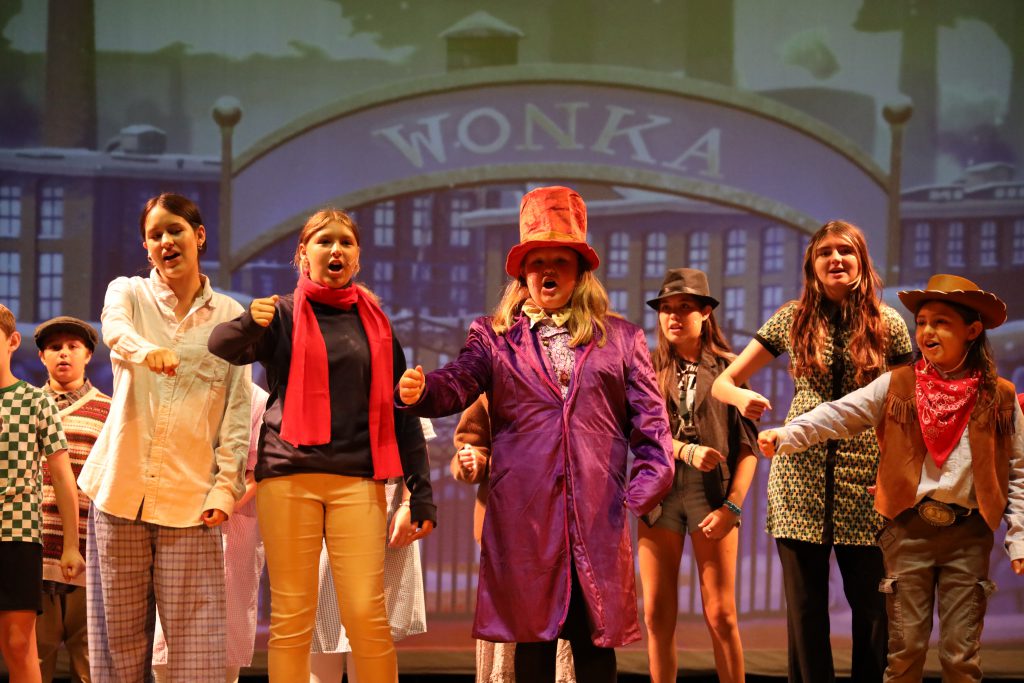 Students performing Wonka on stage