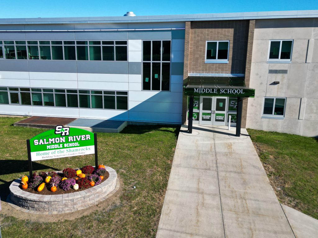 A Middle School entrance with a sign that says 'Salmon River Middle School. Home of the Shamrocks.'